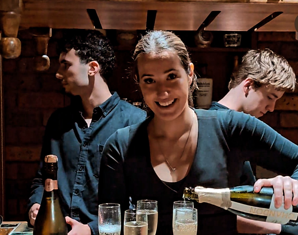Champagne being poured by the event bar team