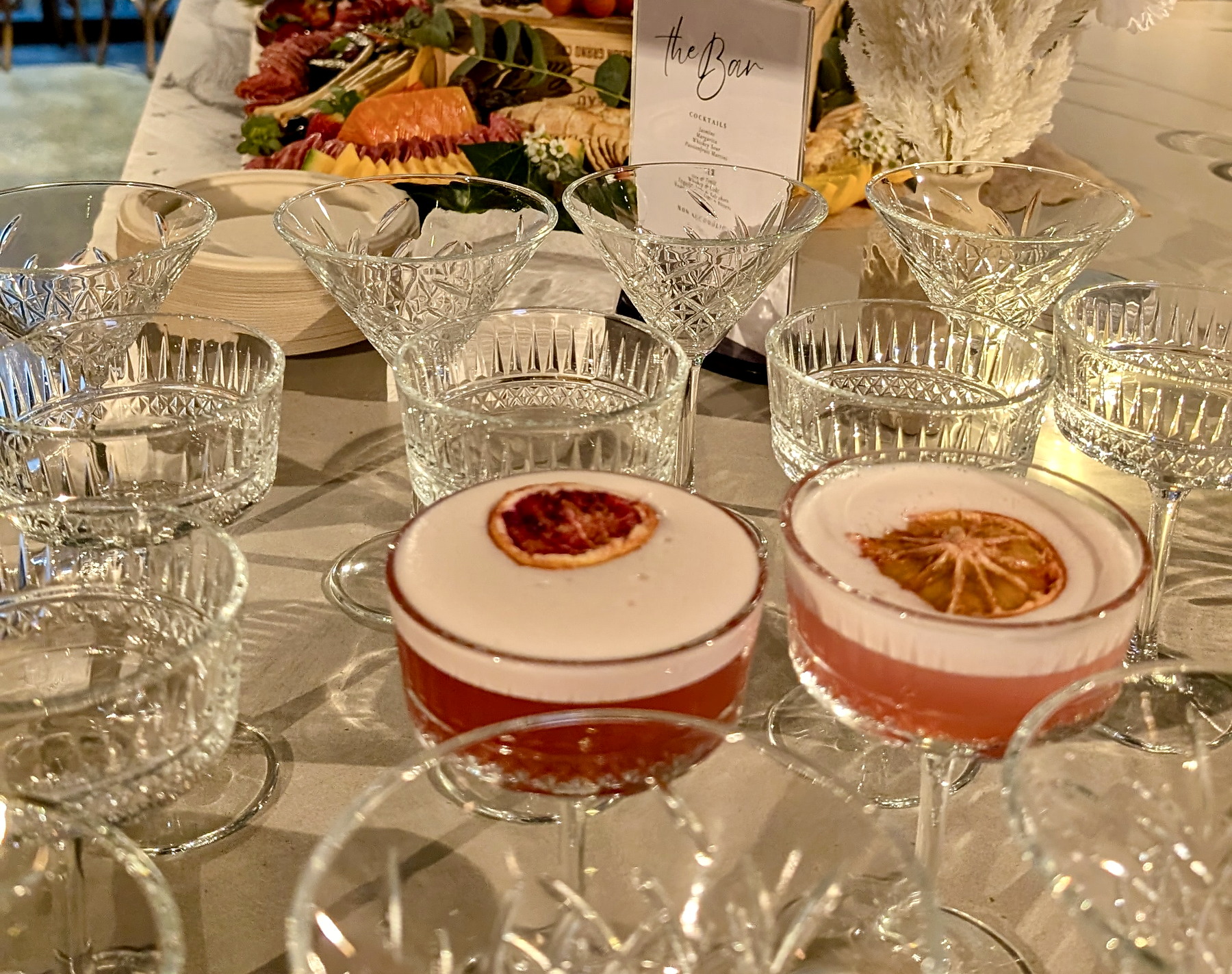 Elegant event glassware and cocktails arranged for service