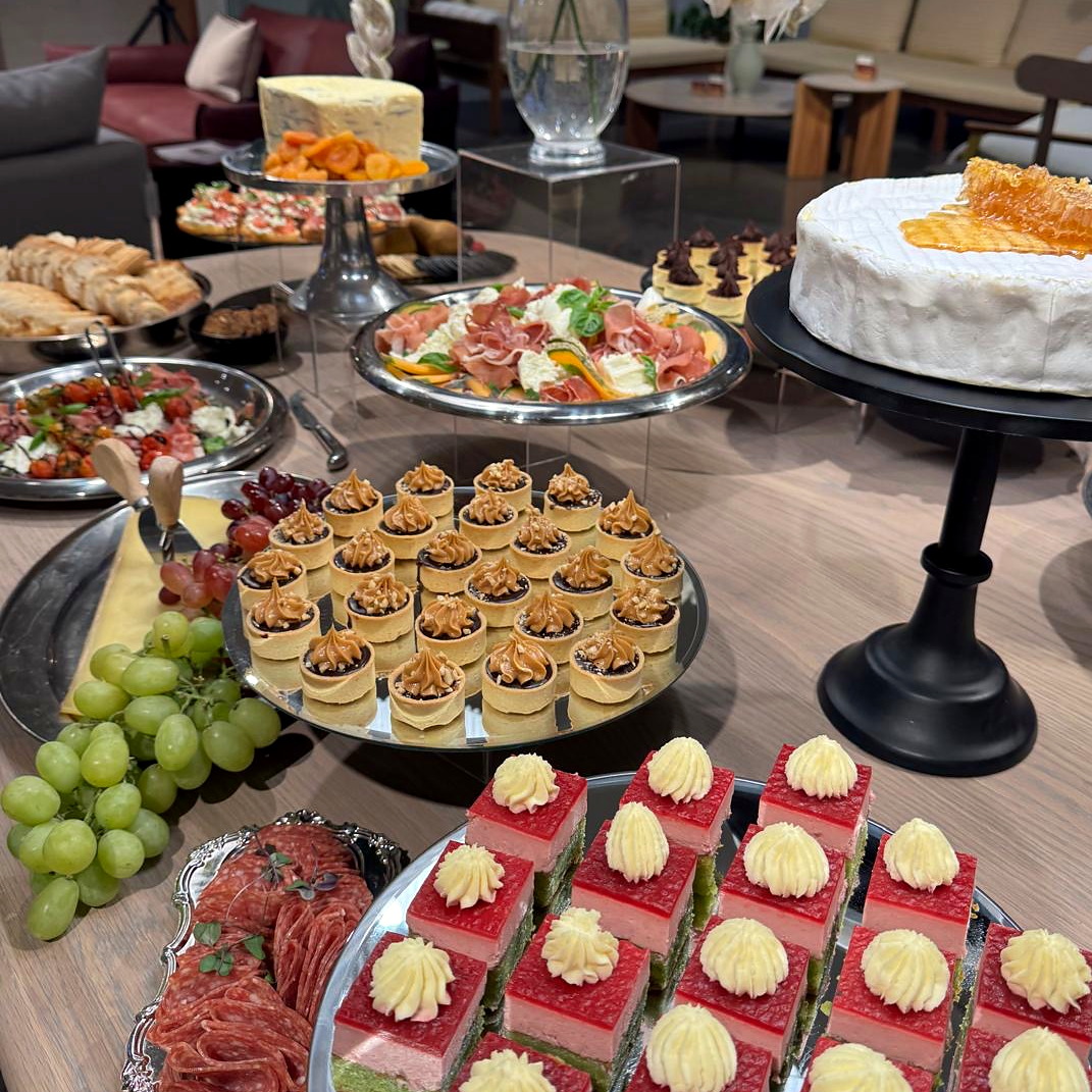 Petit fours presented with a feature cheese wheel and grazing accompaniments