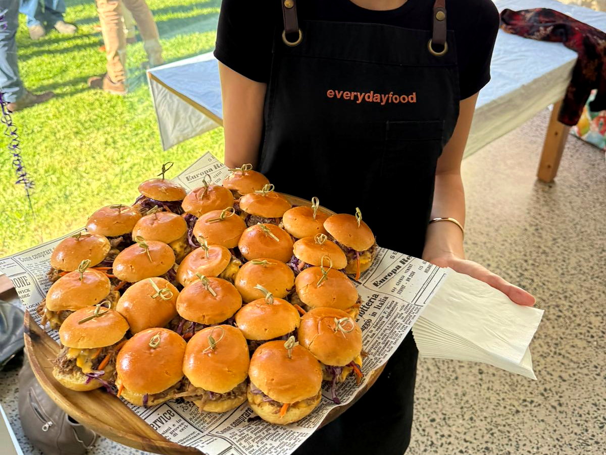 An everydayfood team member presenting a tray of bao buns