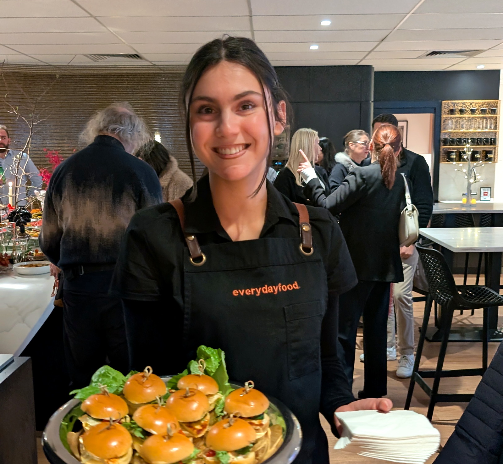 An everydayfood team member presenting canapes