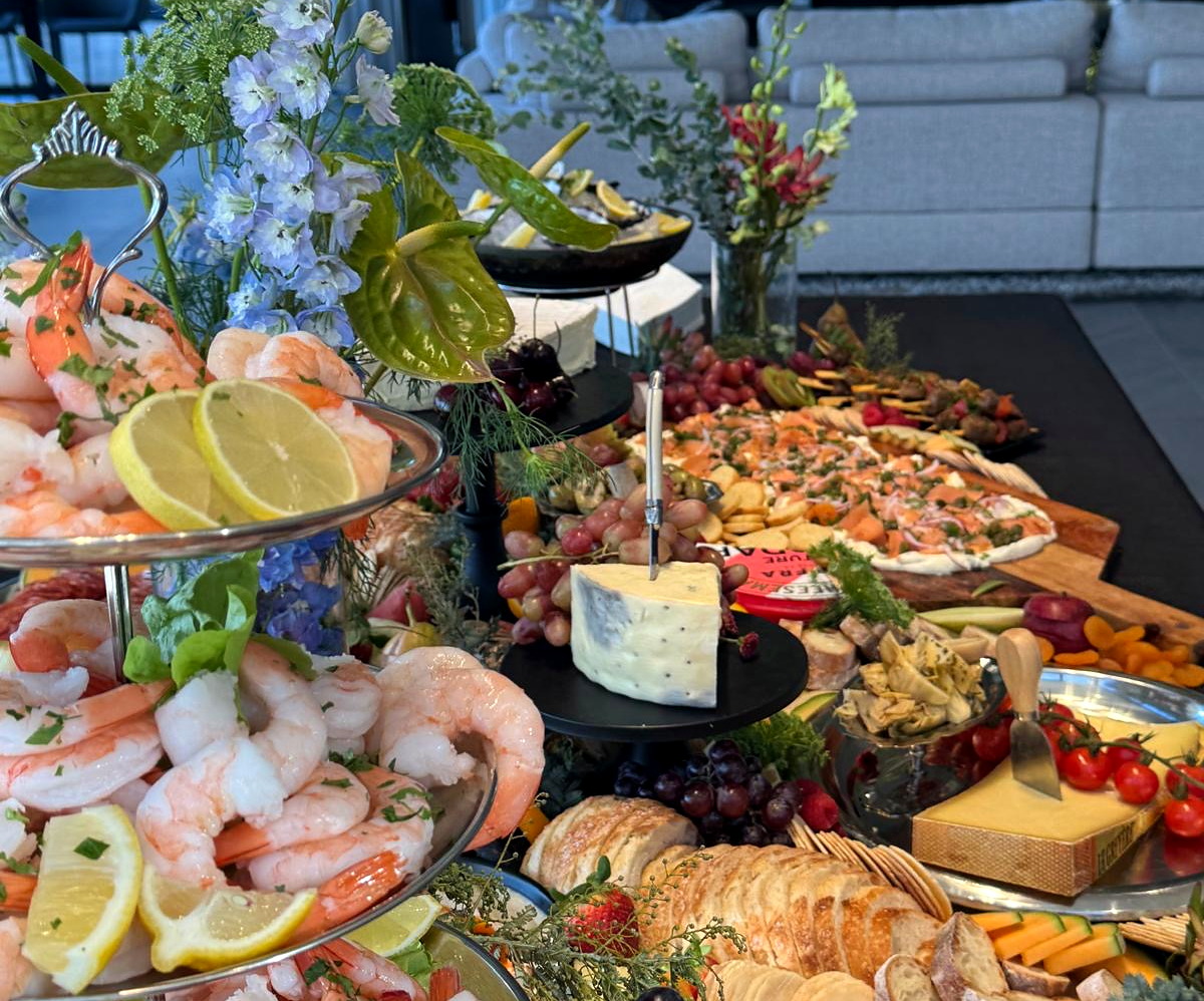 An abundant everydayfood grazing table with premium seafood