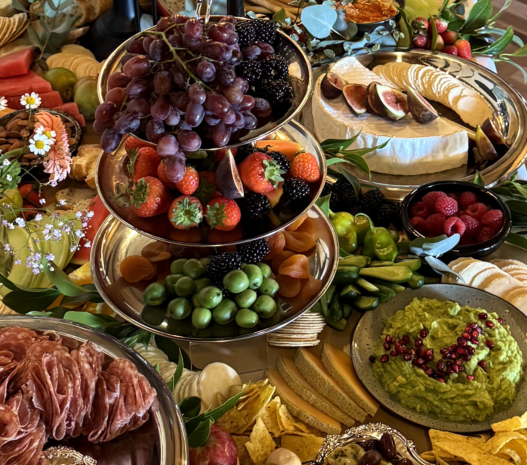 An abundant everydayfood grazing table filled with premium produce