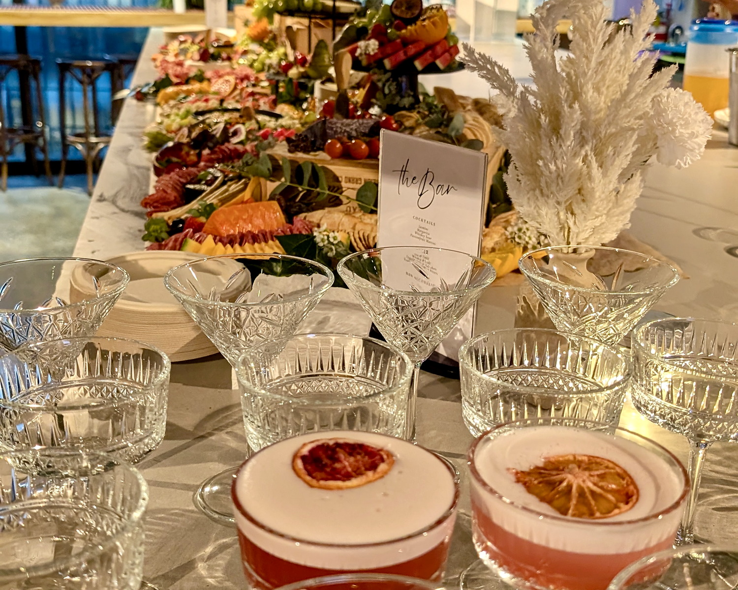 A styled cocktail and event equipment setup