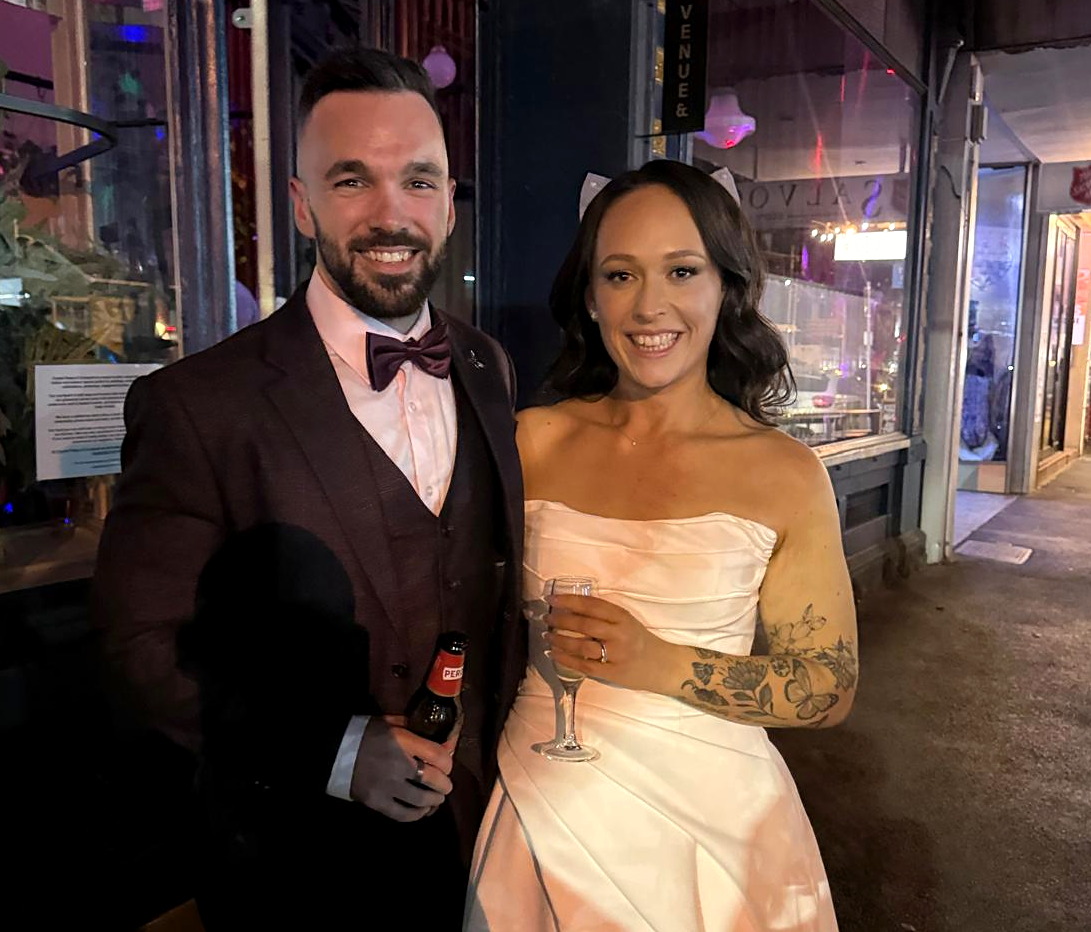 A bride and groom at their wedding celebration