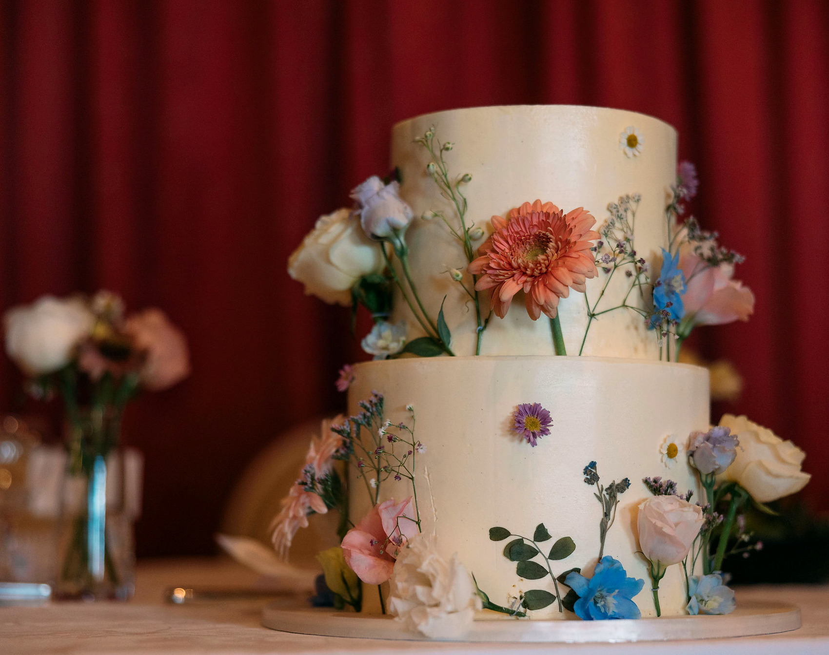 A floral wedding cake at an everydayfood catered celebration