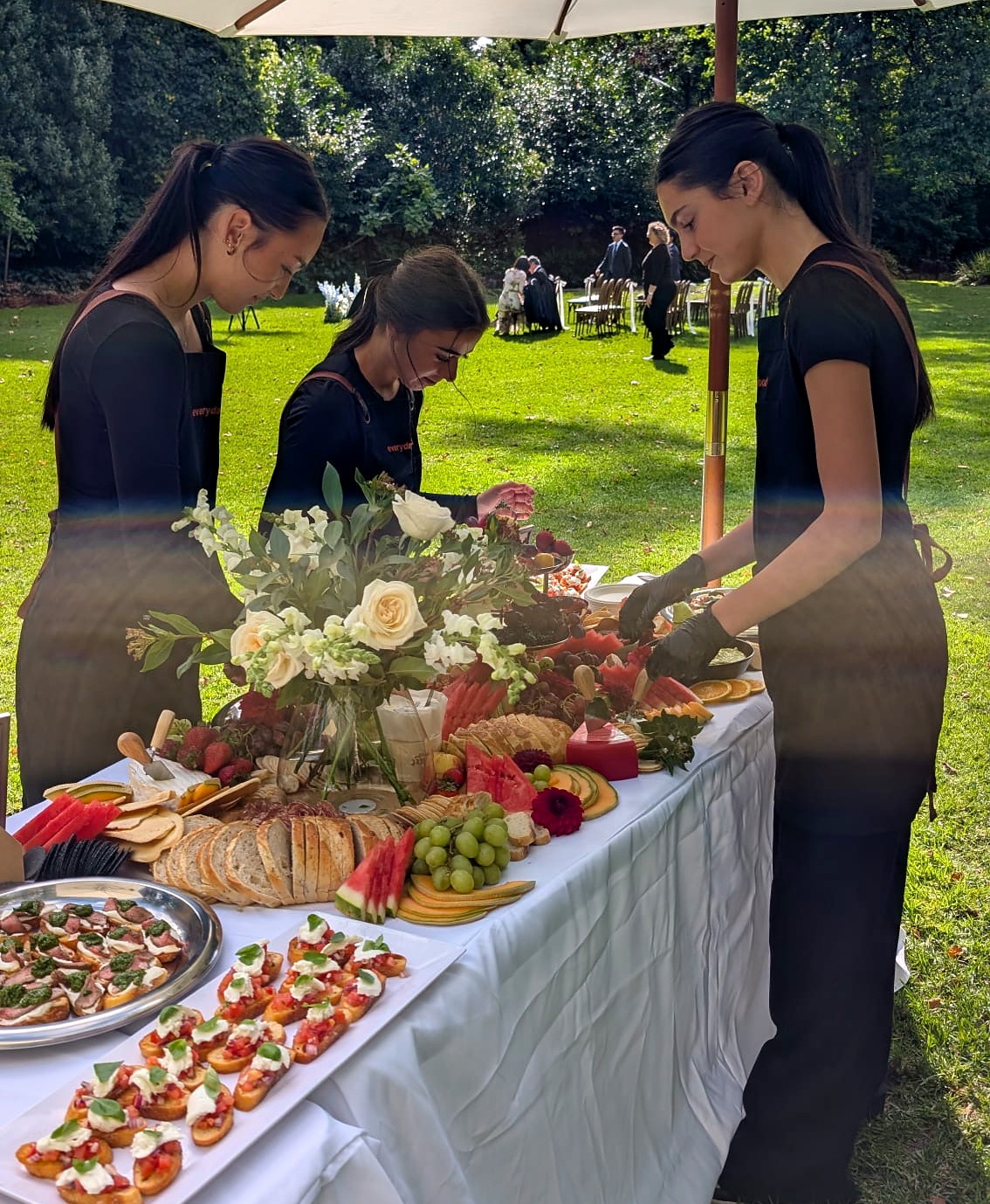 Everydayfood staff arranging a wedding grazing table