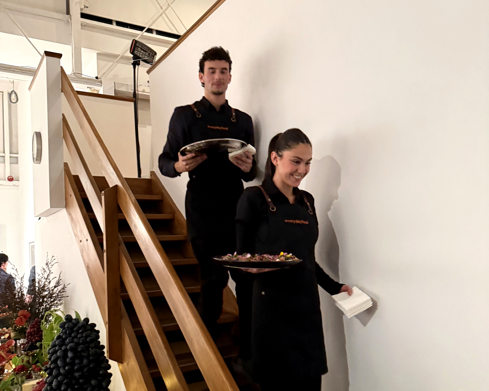 Everydayfood staff carrying food into an event